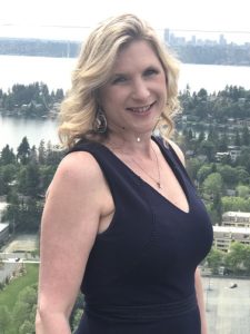 Woman with lake view in background