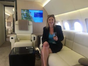 business woman sitting in a private airplane